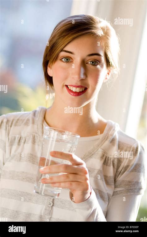 Girl Drinking Glass Of Water Stock Photo Alamy