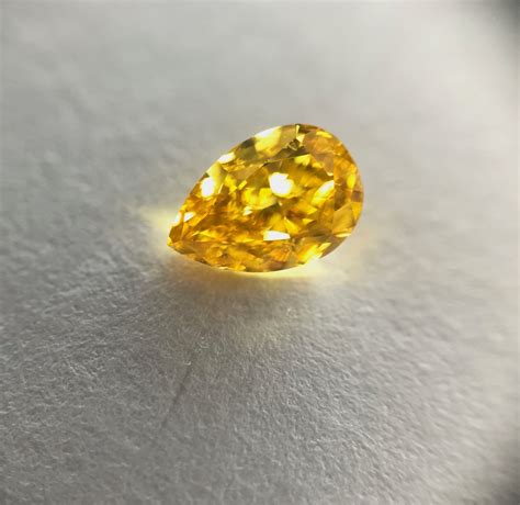 071 Carat Fancy Vivid Yellow Orange Diamond Pear Shape