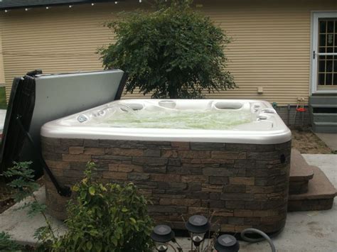 hot spring spa grandee with spastone cabinet installed by hot spring spas of iowa hot tub