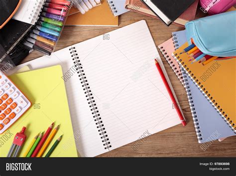 Busy Students Desk With Blank Open Notebook Stock Photo And Stock Images