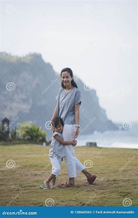 Asian Woman And His Daughter Walking Around Park Looking At Came Stock Image Image Of Love