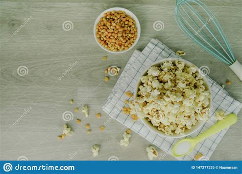 With the mixer running, add 3 eggs, 1 egg at a time. Popcorn In White Bowl With Pastel Spoon, Salt, Hand Mixer ...