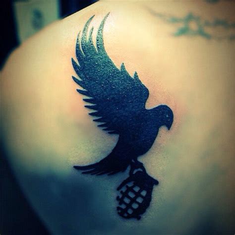 Hollywood undead dove and a grenade tattoo