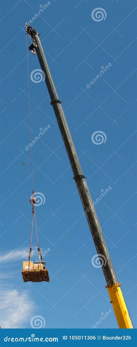 A Crane Lifting A Pallet With A Heavy Cable Editorial Photo Image Of