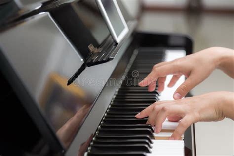 Close Up Of Woman Hands Playing Piano On Background Stock Photo Image