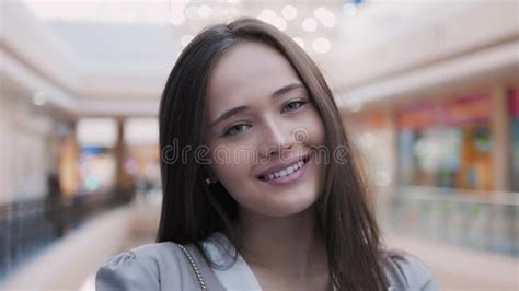 Happy Young Woman Looking At Camera With Smile In Mall Beautiful Portrait Of Model Brunette