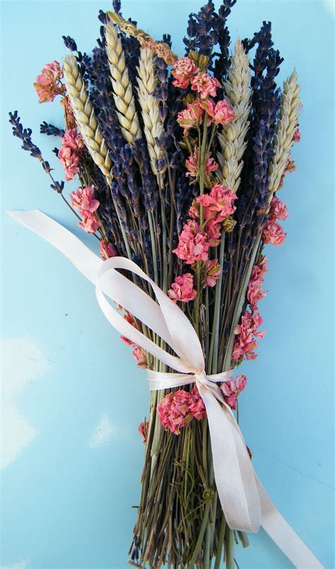 Drying them in the dark will preserve their colour and scent as much as possible, but the downside to this method is that your blooms are likely to become muted or darker in colour. Dried flower bouquet with lavender flowers, pink ...