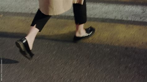 Crop Stylish Woman Walking On Crosswalk By Stocksy Contributor