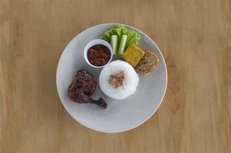 Pecel Ayam Fried Chicken With Sambal And Fresh Vegetables Stock Image