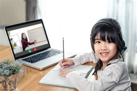 Homeschool Asian Little Young Girl Learning Online Class From School