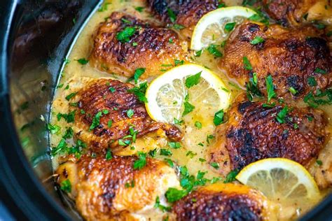 Not only is slow cooker chicken the easiest and least expensive way i've found to prepare it, but you get a couple quarts of chicken broth from it too! Ultimate Slow Cooker Lemon Chicken Thighs