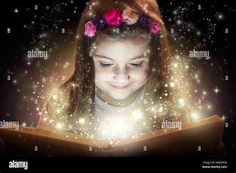 Little Girl Reading Magic Book Fantasy Concept Stock Photo Alamy