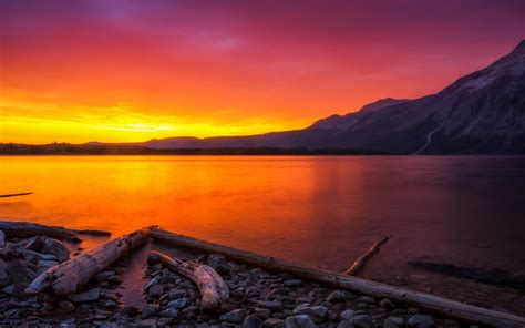 Orange Sunset Over A Mountain Lake