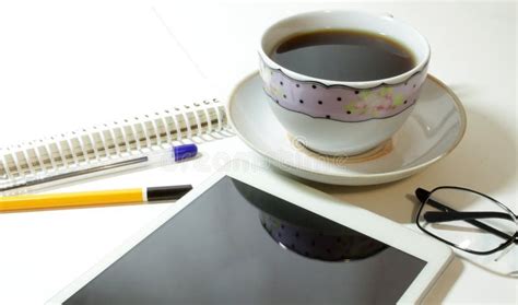 Notepad With Pencil And Pen With Cup Of Coffee And Touch Pad Stock