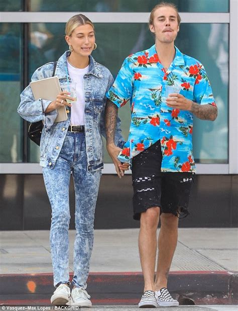 justin bieber and hailey baldwin hold hands and pose with fans as they take a relaxed stroll