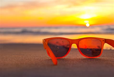 Sunglasses On The Beach While Sunset Stock Photo Download Image Now