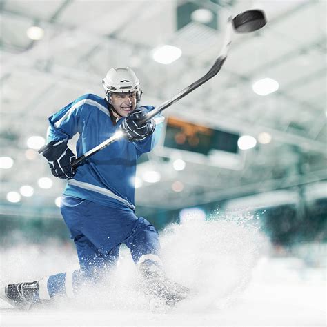 Ice Hockey Player Shooting Puck By Bernhard Lang