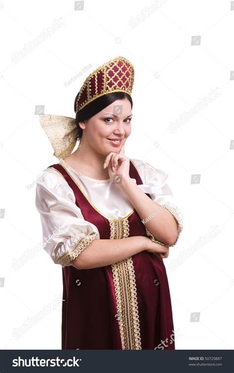 Girl Standing In Russian Traditional Costume Woman Is Wearing Sarafan And Kokoshnik The Girl
