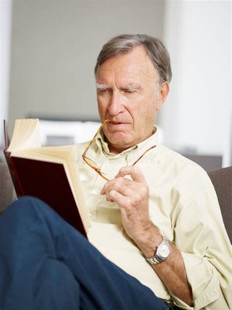 Senior Man Reading Book Stock Photo Image Of Camera 11230432