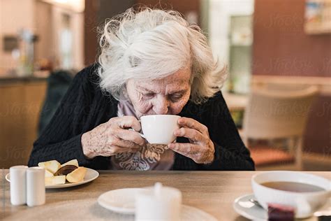 Old Woman Drinking Tea By Irina Efremova