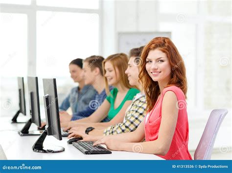 Female Student With Classmates In Computer Class Stock Photo Image