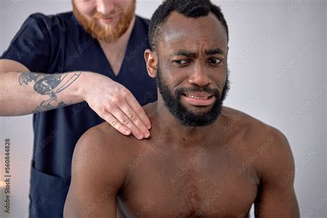 Cropped Caucasian Spa Therapist Making Relaxing Massage For Handsome Middle Aged Black Man