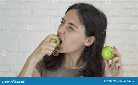 Female With Braces On Her Teeth Eating Green Apple And Smile White Stock Footage Video Of