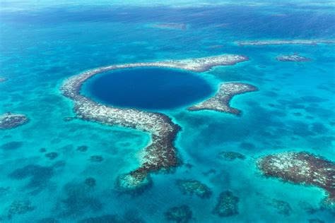 The blue hole in belize is a limestone sinkhole, and is perfectly circular. UnBelizeable!5 Must Do Activities in Belize - Wandering Wagars