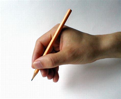 Hand Holding Pencil