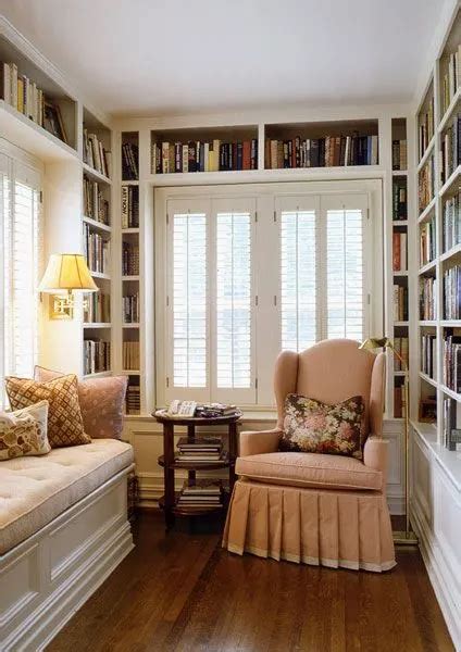 A Living Room Filled With Lots Of Furniture And Bookshelves Next To A