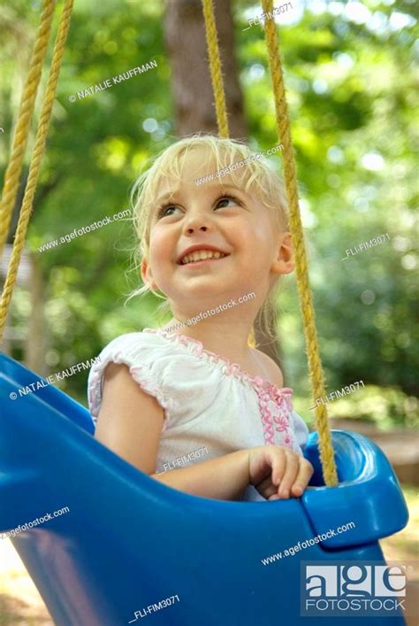 Babe Girl Smiling On A Swing Stock Photo Picture And Rights Managed Image Pic FLI FIM