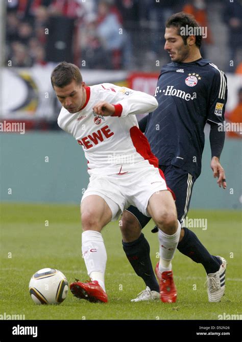 Colognes Lukas Podolski And Munichs Hamit Altintop Vie For The Ball