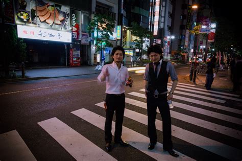 two guys on the streets of tokyo just walked by