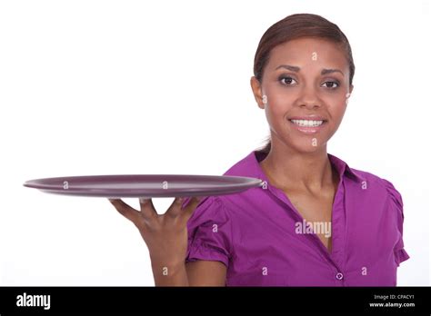 Attractive Young Waitress Holding An Empty Tray Stock Photo Alamy