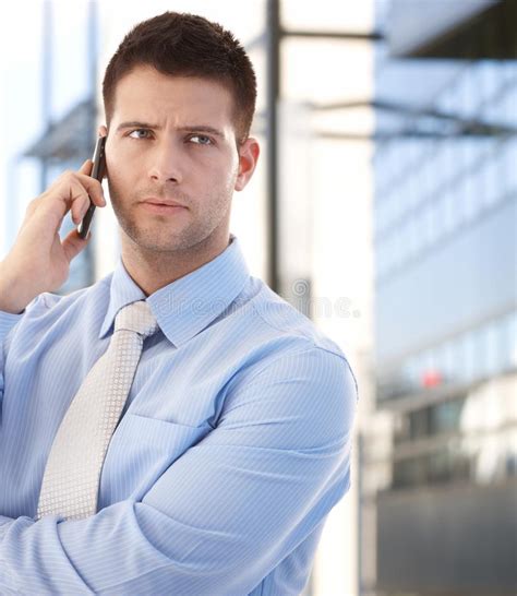 Smiling Young Businessman Talking On Mobile Phone Stock Photo Image