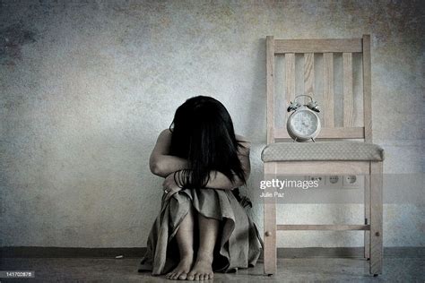 Sad Girl With Her Head Down On Her Knees Bildbanksbilder Getty Images