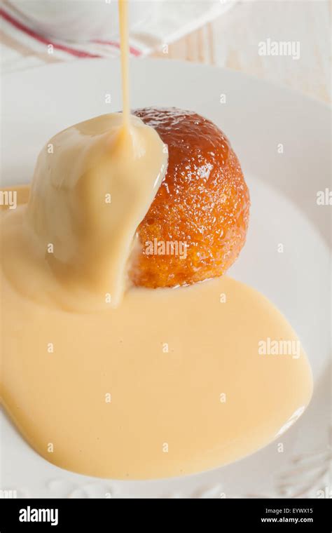 Steamed Golden Syrup Sponge Pudding And Vanilla Custard Stock Photo Alamy