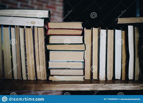 Lots Of Books Sideways On A Shelf In The Library Stock Photo Image Of