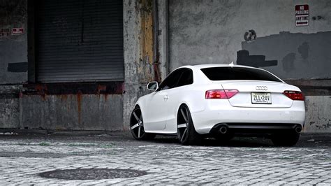 White Audi Coupe Parked Near Gray Painted Concrete Wall Hd Wallpaper