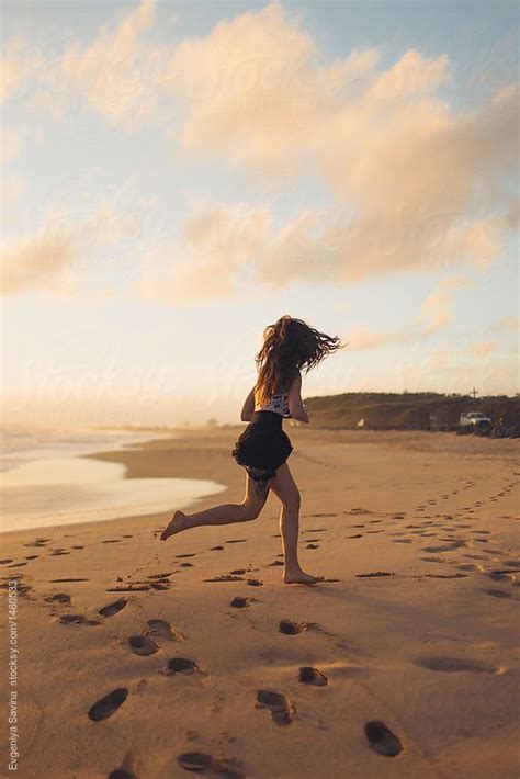 A Girl Running On The Beach Barefoot By Evgeniya Savina For Stocksy United Running On The Beach