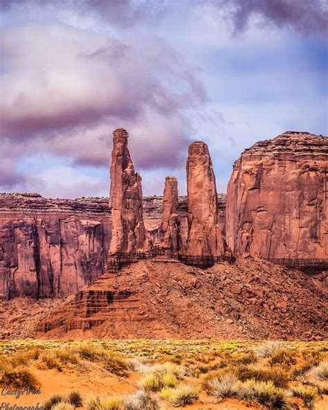 The Back View Of The Three Sisters Rock In Monument Valley