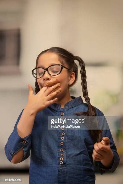 Girl Licking Fingers Photos And Premium High Res Pictures Getty Images