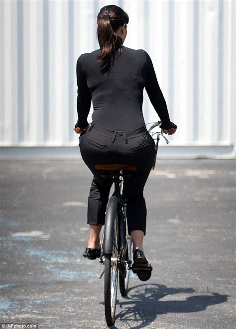 Kim Kardashian Lands On Her Derriere After Taking A Tumble During Bike