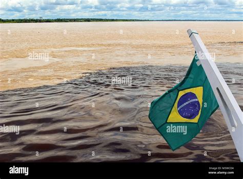Meeting Of The Waters Of Rio Negro And The Amazon River Or Rio Solimoes