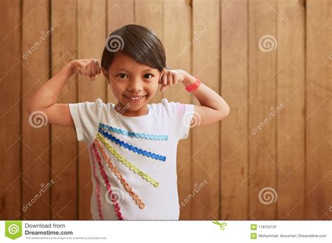 Asian Little Girl Showing Muscle Stock Image - Image of attractive ...