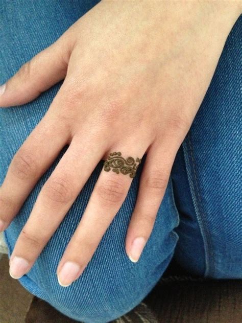 Trying simple mehndi finger design is also about personal preference. ring finger henna | Mandeep K.'s Photo | Beautylish