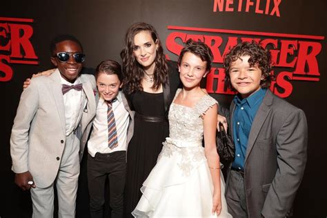 The Cast Of Stranger Things Pose On The Netflix Series Red Carpet
