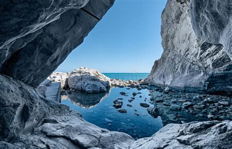 Sea Cave Rocks Grotto With Water Reflections Stock Image Image Of