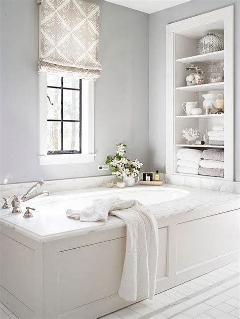 To avoid making this room seem small and claustrophobic, the design here is focused on white (and a lot of it!) with black to accentuate mirrors, windows, and doors. White Bathroom Design Ideas | Better Homes & Gardens