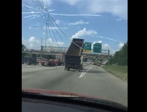 Video Dump Truck Takes Out Houston Highway Sign